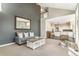 Open-concept space with high ceilings, comfortable seating, and seamless flow to the modern kitchen at 6406 Eagle Ct, Longmont, CO 80503
