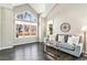 Bright living room features vaulted ceilings, large windows, and comfortable seating for relaxation at 6406 Eagle Ct, Longmont, CO 80503