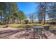 Stone patio with outdoor dining set, surrounded by lush landscaping, perfect for entertaining at 6406 Eagle Ct, Longmont, CO 80503