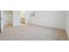 Neutral bedroom with carpet, a walk-in closet, and a well-lit bathroom at 6500 13Th St, Frederick, CO 80530