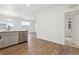 Open-concept kitchen featuring a breakfast bar and access to a dining area and adjacent room at 6500 13Th St, Frederick, CO 80530
