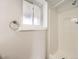 Bathroom featuring shower with white tiling and a window at 11062 Hudson Ct, Thornton, CO 80233