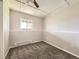 Cozy carpeted bedroom with natural light, neutral paint, and heater, offering a comfortable and versatile space at 11062 Hudson Ct, Thornton, CO 80233