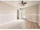 Well-lit bedroom featuring neutral walls and flooring with a ceiling fan and an open closet at 11062 Hudson Ct, Thornton, CO 80233