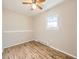 Cozy bedroom featuring wood floors, natural light, and a ceiling fan at 11062 Hudson Ct, Thornton, CO 80233