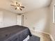 Bright bedroom featuring modern flooring, a ceiling fan, and a comfortable bed, creating a tranquil and inviting space at 11062 Hudson Ct, Thornton, CO 80233