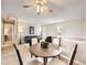 Cozy dining area with modern furnishings and neutral color palette, next to the living room at 11062 Hudson Ct, Thornton, CO 80233
