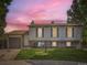 Charming two-story home with vinyl siding, brick accents, landscaped lawn, and an attached garage at 11062 Hudson Ct, Thornton, CO 80233