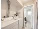 Functional laundry room with washer, dryer, and storage leading into the bathroom at 11062 Hudson Ct, Thornton, CO 80233