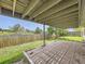 Covered brick patio offering an outdoor space for entertaining or relaxing, with views of the backyard and sky at 11062 Hudson Ct, Thornton, CO 80233
