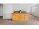 Finished basement bar area with sink and cabinet storage at 8414 Bed Straw St, Parker, CO 80134