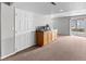 Basement kitchenette with cabinets, a countertop, and a sink near a sliding glass door at 8414 Bed Straw St, Parker, CO 80134