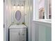 Bathroom with vanity, updated mirror, and a window at 8414 Bed Straw St, Parker, CO 80134