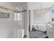This bathroom features a glass shower, soaking tub, and tiled floors at 8414 Bed Straw St, Parker, CO 80134