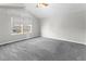 Bright bedroom with carpet, large windows offering natural light and backyard views at 8414 Bed Straw St, Parker, CO 80134