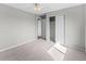 Comfortable bedroom with a ceiling fan, neutral carpet, and closet with sliding doors at 8414 Bed Straw St, Parker, CO 80134