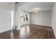 Welcoming entryway with wood floors, showcasing the bright and airy living space with a view of the outside at 8414 Bed Straw St, Parker, CO 80134