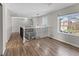 Upstairs hallway features wood floors, neutral paint, and decorative railing on the staircase at 8414 Bed Straw St, Parker, CO 80134