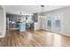 Open layout showcasing the modern kitchen with gray cabinets and stainless appliances with a view of the backyard at 8414 Bed Straw St, Parker, CO 80134