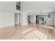 Spacious living room with wood flooring and an open floor plan leading into the kitchen at 8414 Bed Straw St, Parker, CO 80134
