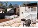 Outdoor patio with comfortable seating and dining area, perfect for enjoying the backyard at 3746 Jason St, Denver, CO 80211