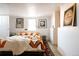 Inviting bedroom with colorful quilt, area rug, and vintage decor at 3746 Jason St, Denver, CO 80211