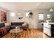 Open-concept living space with modern decor, hardwood floors, and great natural light at 3746 Jason St, Denver, CO 80211