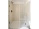 Updated shower with tiled walls, glass door, and modern fixtures at 3746 Jason St, Denver, CO 80211