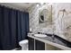 Charming bathroom featuring black and white toile wallpaper and black vanity at 3228 Country Club Pkwy, Castle Rock, CO 80108
