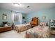 Bright bedroom features twin beds, light blue walls and natural light at 3228 Country Club Pkwy, Castle Rock, CO 80108