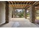 Covered patio with stone columns overlooking the backyard and greenbelt is a great space to relax at 3228 Country Club Pkwy, Castle Rock, CO 80108