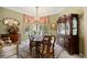 Formal dining room with elegant chandelier, large windows, and traditional furnishings at 3228 Country Club Pkwy, Castle Rock, CO 80108