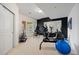 Light and bright workout room has mirrored walls, a window, and plenty of space for exercise equipment at 3228 Country Club Pkwy, Castle Rock, CO 80108