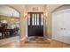 Inviting foyer features hardwood floors, large front door, and access to the dining room at 3228 Country Club Pkwy, Castle Rock, CO 80108