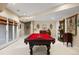 Well appointed game room showcases the pool table and piano at 3228 Country Club Pkwy, Castle Rock, CO 80108