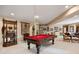 Open concept game room features a pool table, bar area, and seating at 3228 Country Club Pkwy, Castle Rock, CO 80108