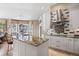 Stylish kitchen with granite island, stainless hood, and decorative backsplash open to the adjacent dining area at 3228 Country Club Pkwy, Castle Rock, CO 80108