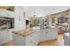 Spacious kitchen features granite countertops, stainless appliances, and a breakfast nook with natural light at 3228 Country Club Pkwy, Castle Rock, CO 80108