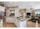 Kitchen with granite island, stainless steel appliances, and an open layout that flows into the living area at 3228 Country Club Pkwy, Castle Rock, CO 80108