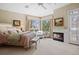 Spacious main bedroom features a fireplace, sitting area, plush carpeting, and great natural light at 3228 Country Club Pkwy, Castle Rock, CO 80108