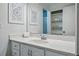 Bathroom with a large mirror, vanity, and access to storage at 3053 Mcintosh Dr, Longmont, CO 80503