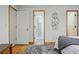 Bedroom with wood floors, white walls, and a door to the en-suite bath at 3053 Mcintosh Dr, Longmont, CO 80503