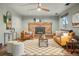 Inviting living room with brick fireplace, plush seating, and stylish decor, creating a cozy atmosphere at 3053 Mcintosh Dr, Longmont, CO 80503
