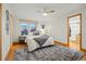 Bright main bedroom with a large window and hardwood floors at 3053 Mcintosh Dr, Longmont, CO 80503