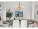 Elegant dining area with a modern chandelier and stylish decor at 10047 Sylvestor Rd, Highlands Ranch, CO 80129