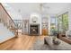 Cozy living room with fireplace, hardwood floors, and comfortable seating, perfect for relaxing at 10047 Sylvestor Rd, Highlands Ranch, CO 80129
