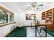 Bright and airy home office featuring a large desk, ample storage, and a comfortable seating area at 10047 Sylvestor Rd, Highlands Ranch, CO 80129