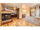 Inviting bathroom with hardwood floors, fireplace, access to the bedroom and a separate vanity area at 1526 Peach Ct, Brighton, CO 80601
