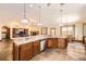 Beautiful kitchen featuring a large island, stainless steel appliances, and open floor plan design at 1526 Peach Ct, Brighton, CO 80601