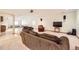 Spacious living room with plush furnishings, carpeted floors, and ample lighting at 1526 Peach Ct, Brighton, CO 80601